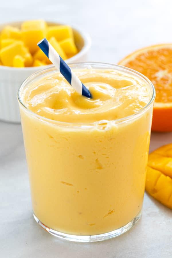 Glass filled with mango smoothie